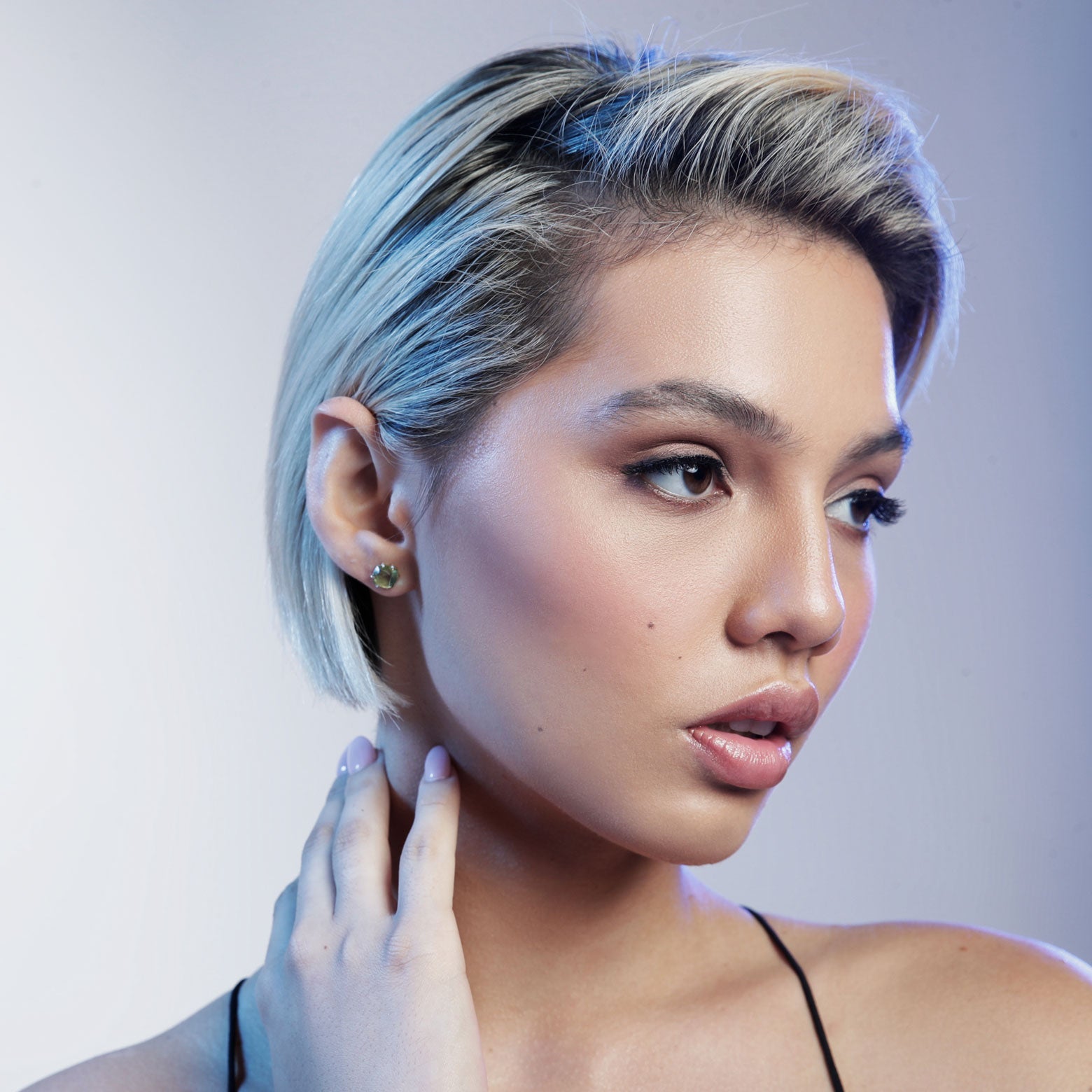 woman wearing Green peridot stud earrings
