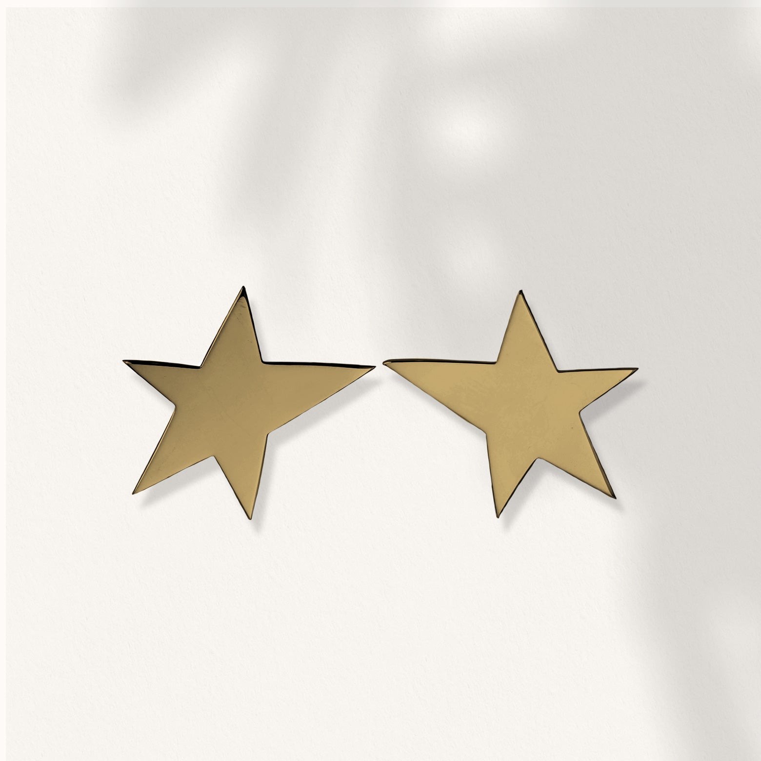 Kelly Woodcroft yellow gold star shaped earrings are made in Brisbane.