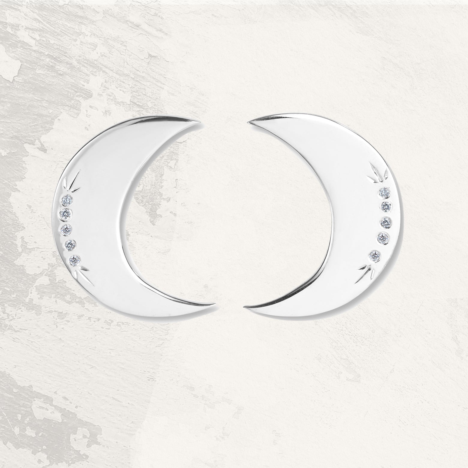 Sterling silver crescent moon earrings with inlaid diamonds